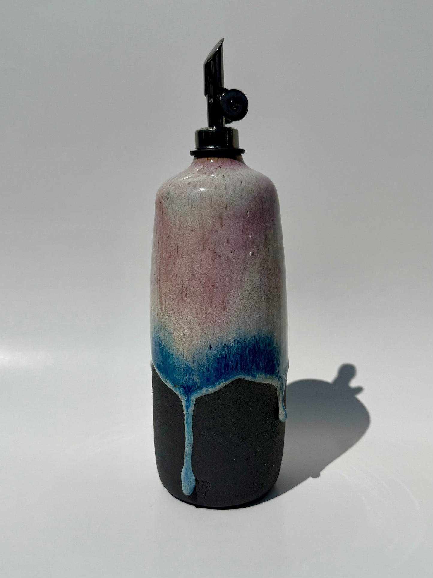 Decorative bottle with a gradient design on a white background