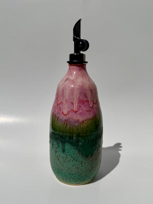 Decorative bottle with a multicolored design on a white background