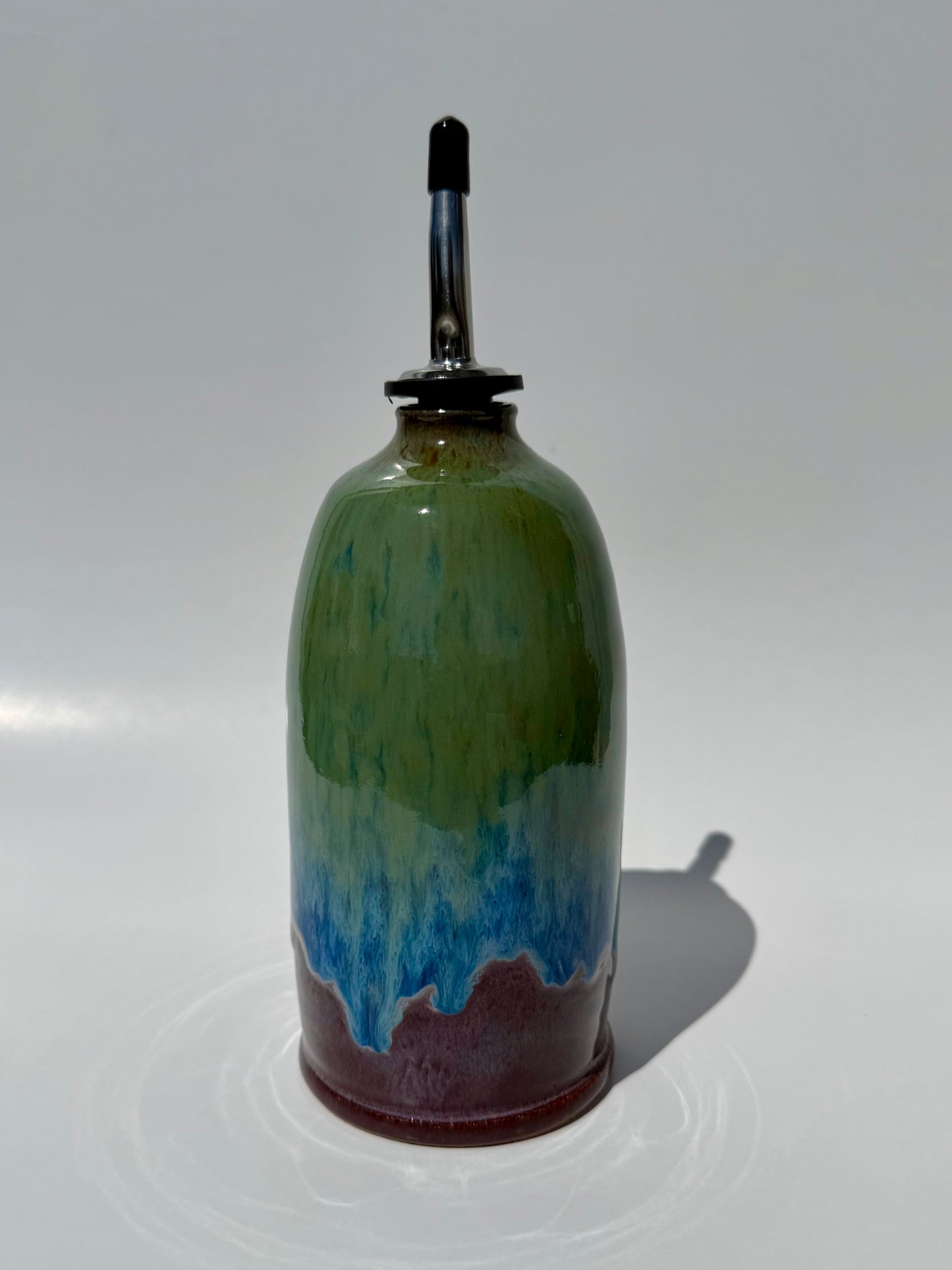 Decorative bottle with gradient colors on a white background