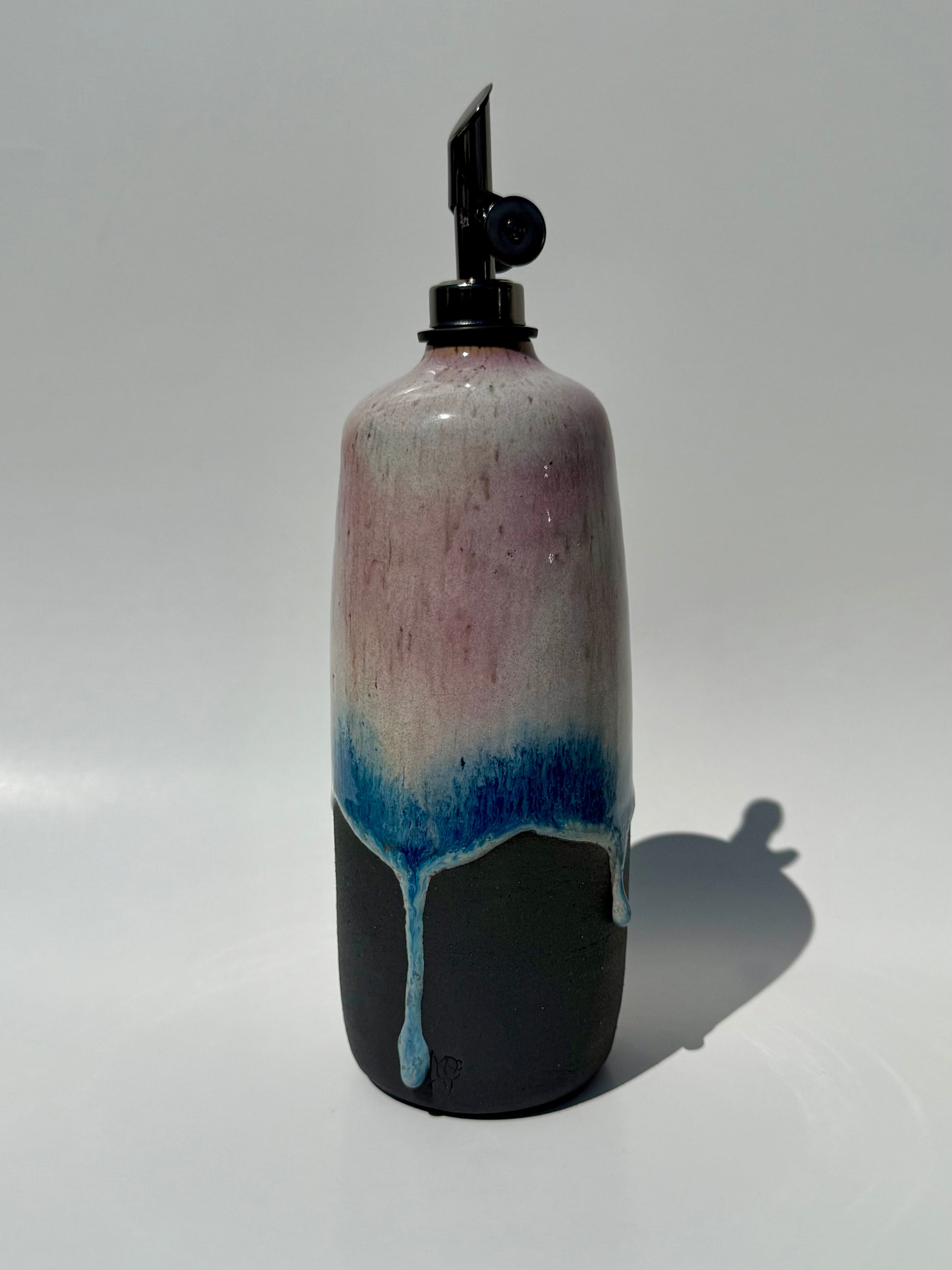 Decorative bottle with a gradient design on a white background