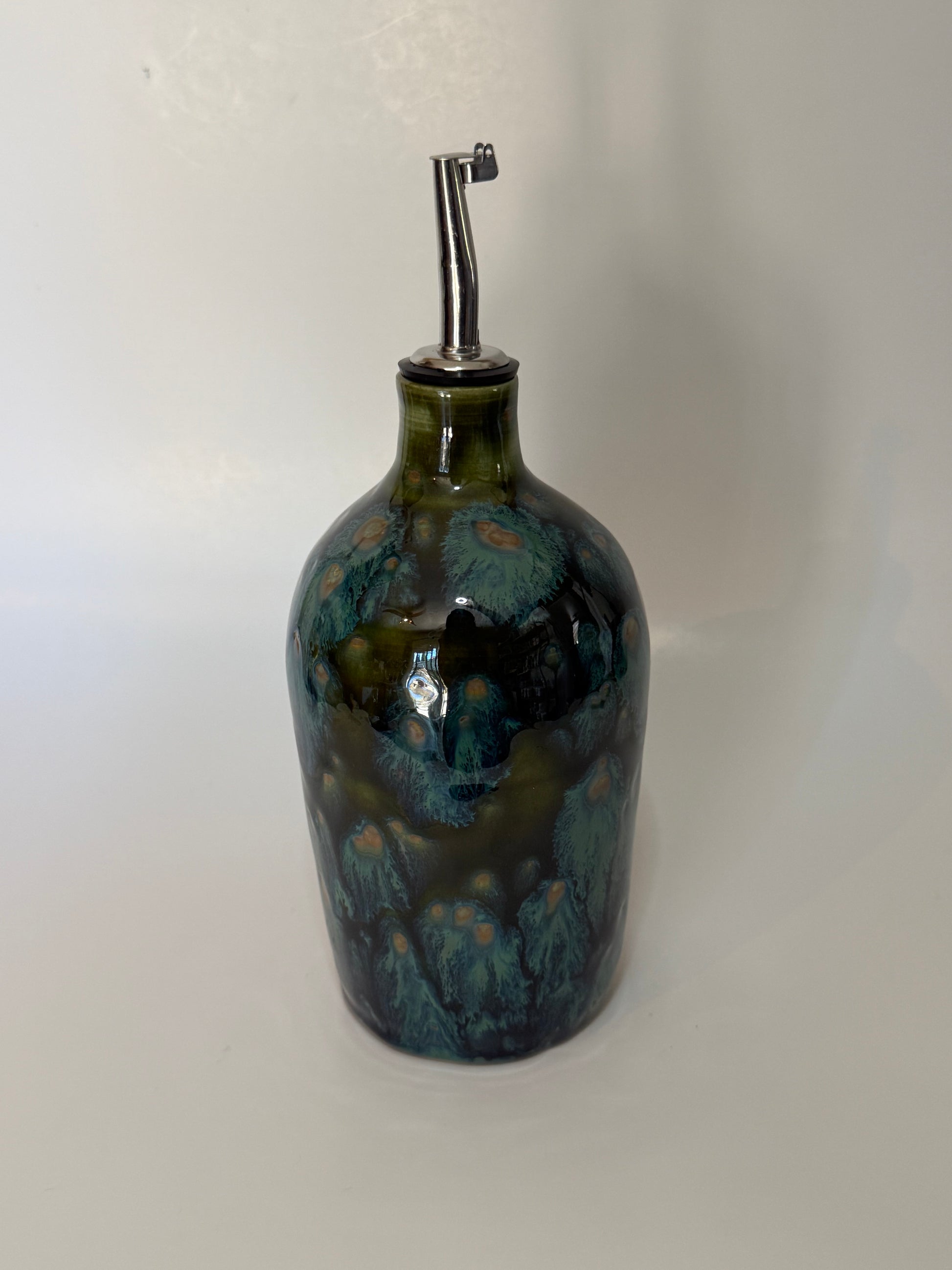Green speckled oil bottle with sliver oil pour nozzle 